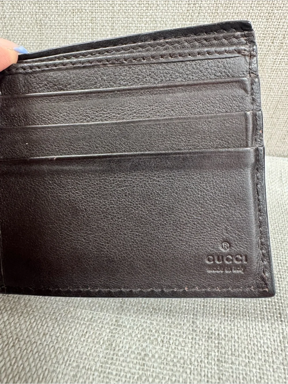 Gucci Dark Brown Embossed GG Leather Bifold Wallet